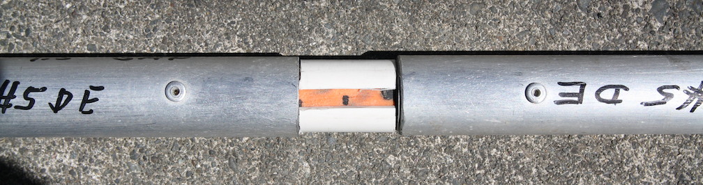 Rod inside tubing ends and split PVC spacer in place